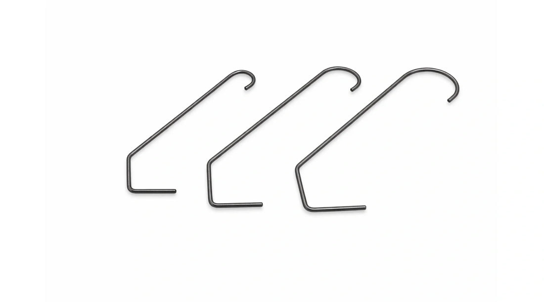 powder coating hooks in different sizes arranged on a plain white background