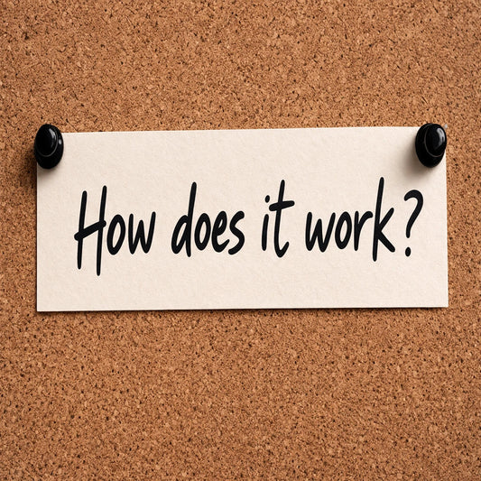 a tacked note saying "how does it work" on a cork backdrop